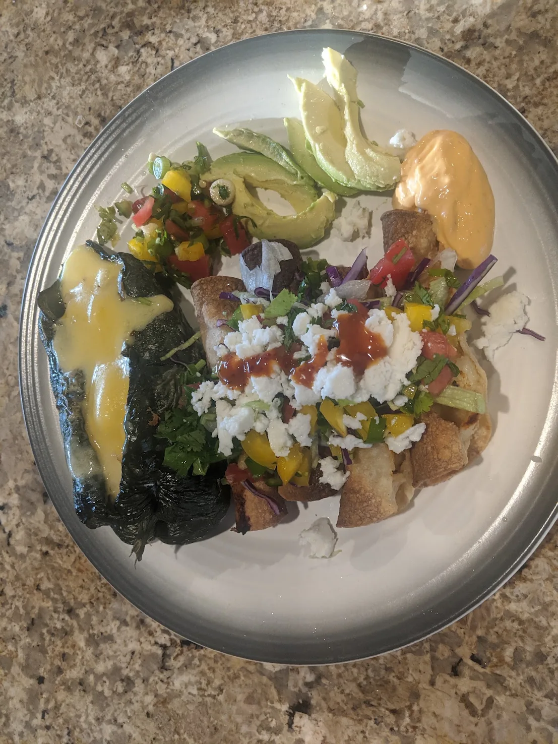 Your plate: taquitos, stuffed poblano, avocado